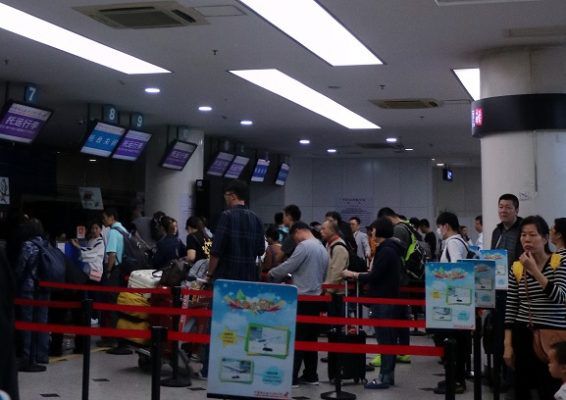 Passengers checking in at Nanyuan Airport. 