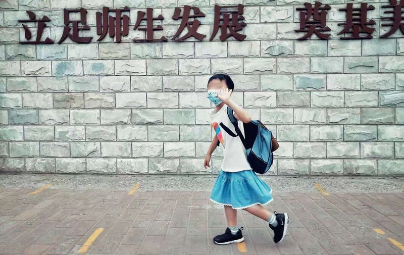 The Chinese boy wore a skirt to school, which garnered mixed reactions from classmates and friends