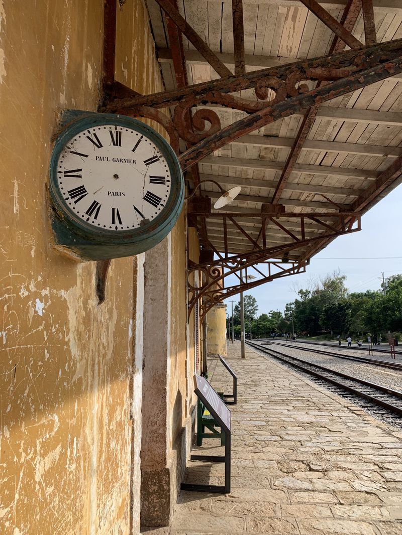 French Clock, Paul Garnier dangles at one of the Bisezhai train stations