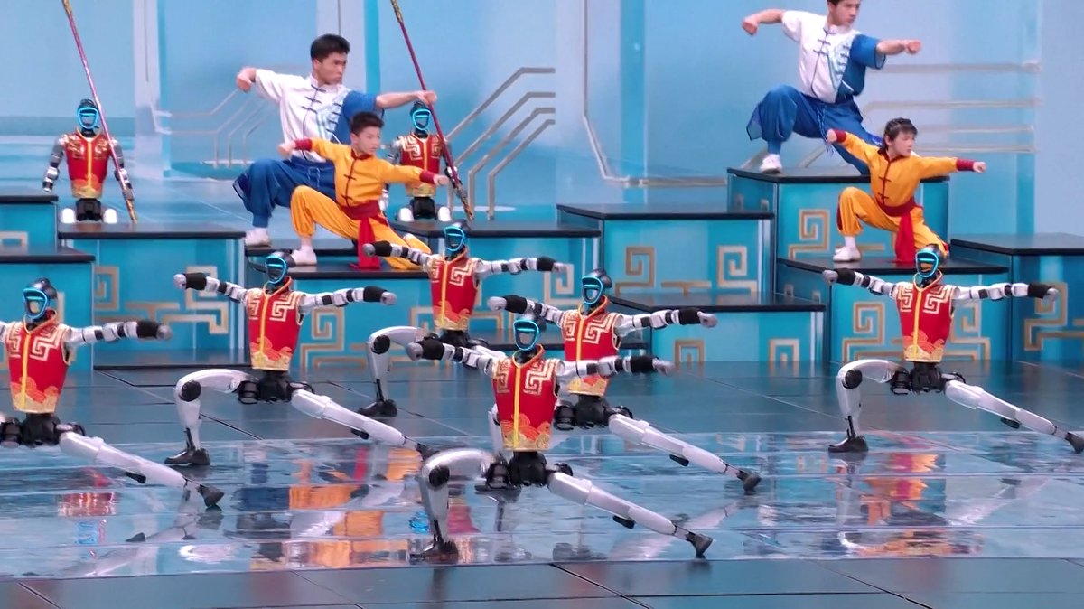 Dozens of humanoid robots performed alongside martial arts students from Henan’s Tagou Martial Arts School during the 2026 Spring Festival Gala, China dancing robots