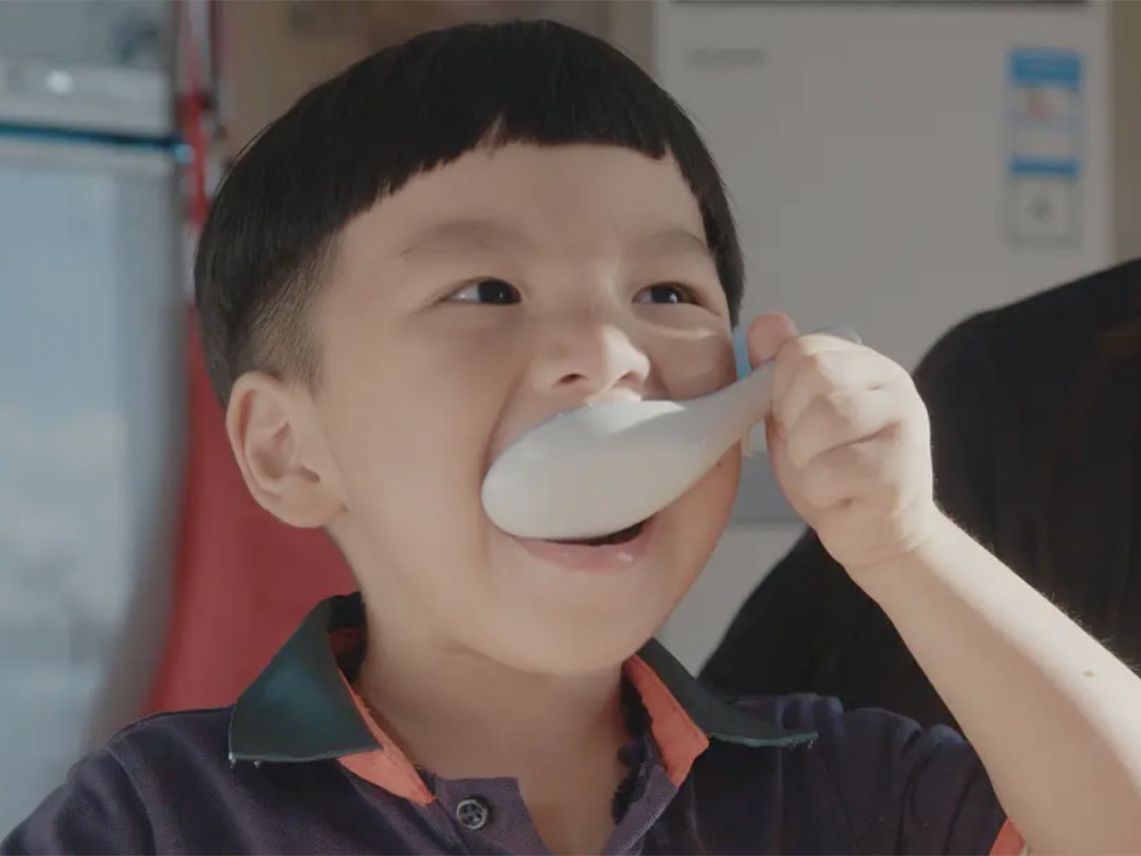 Kid eating rice