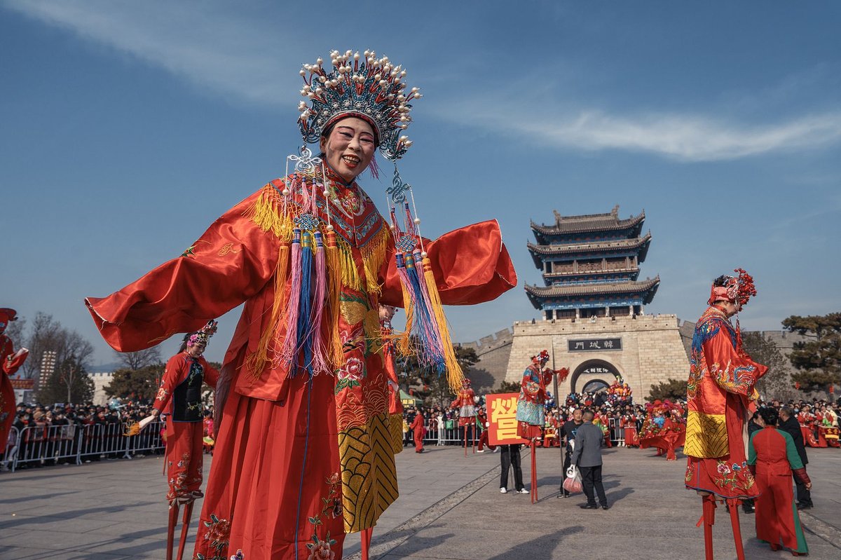A stilt dance during a Shehuo fair in Weinan, Shaanxi