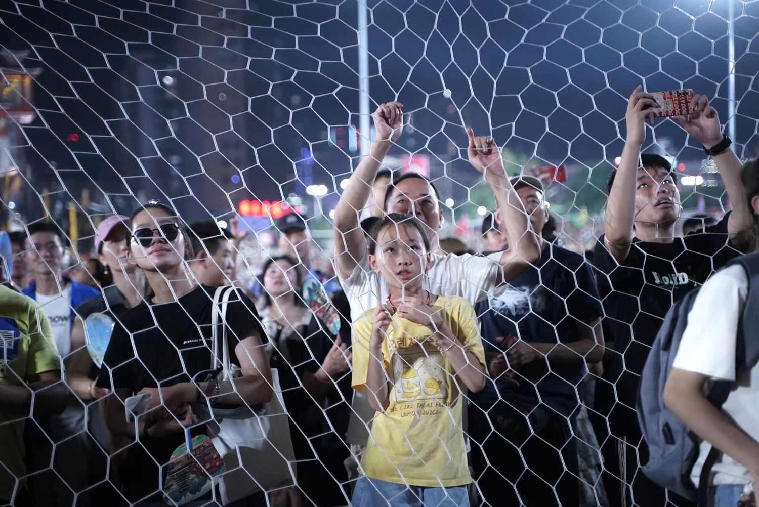 Spectators at village soccer match in Guizhou, China