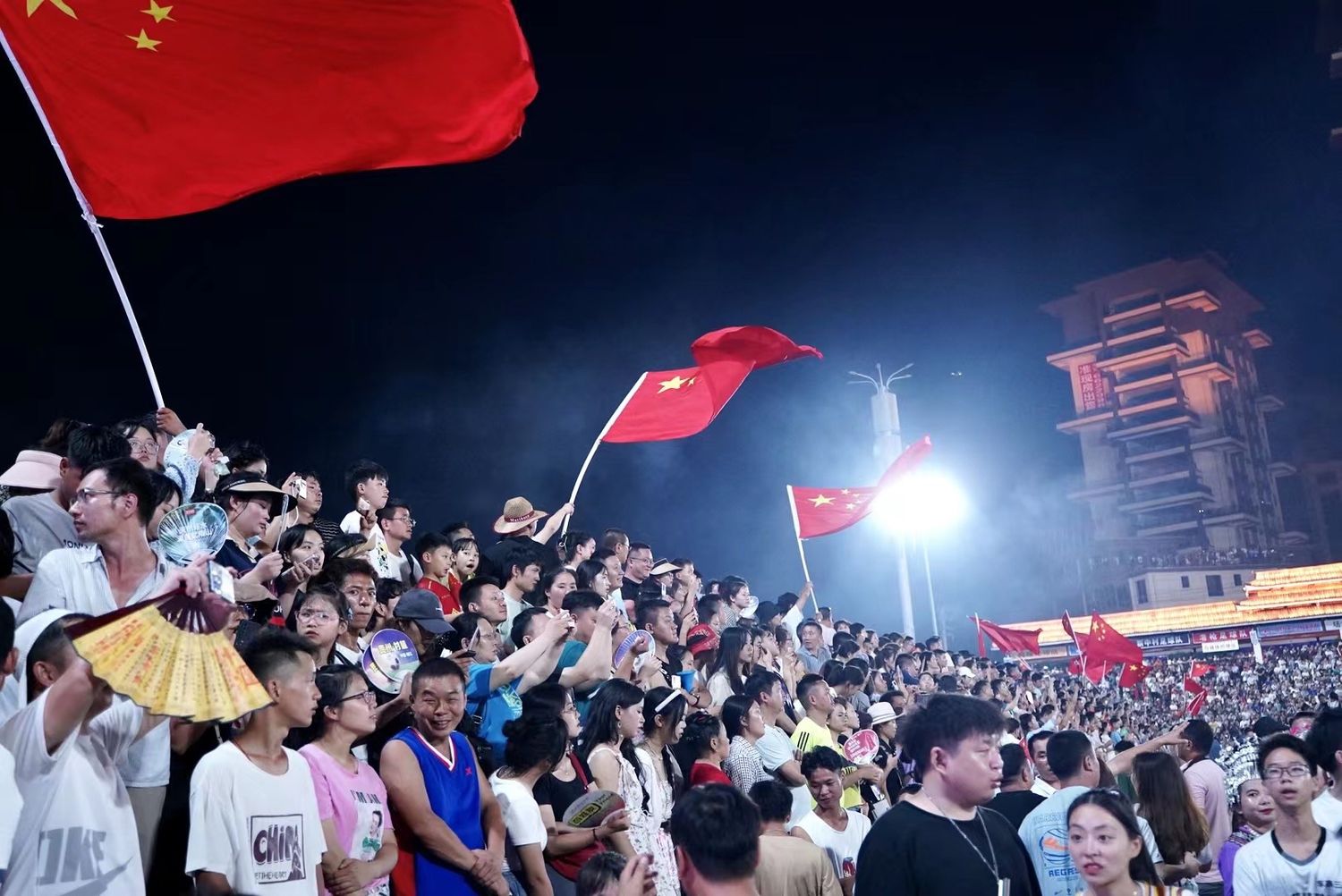 Spectators at village soccer match in Guizhou, China