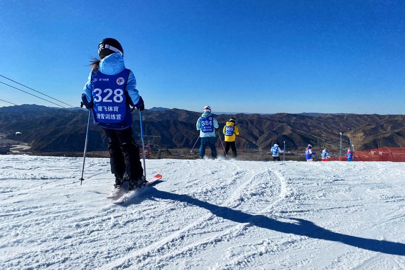 Children at a skiing camp take a lesson at one of Chongli’s ski resorts (Shao Yefan)