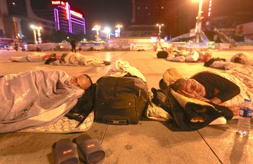 People sleeping at Zhengzhou Railway Station Square