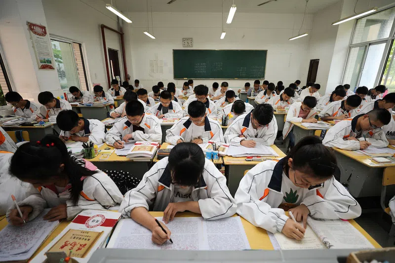 Behind Chinese Entrance Exams are hours of studying in class