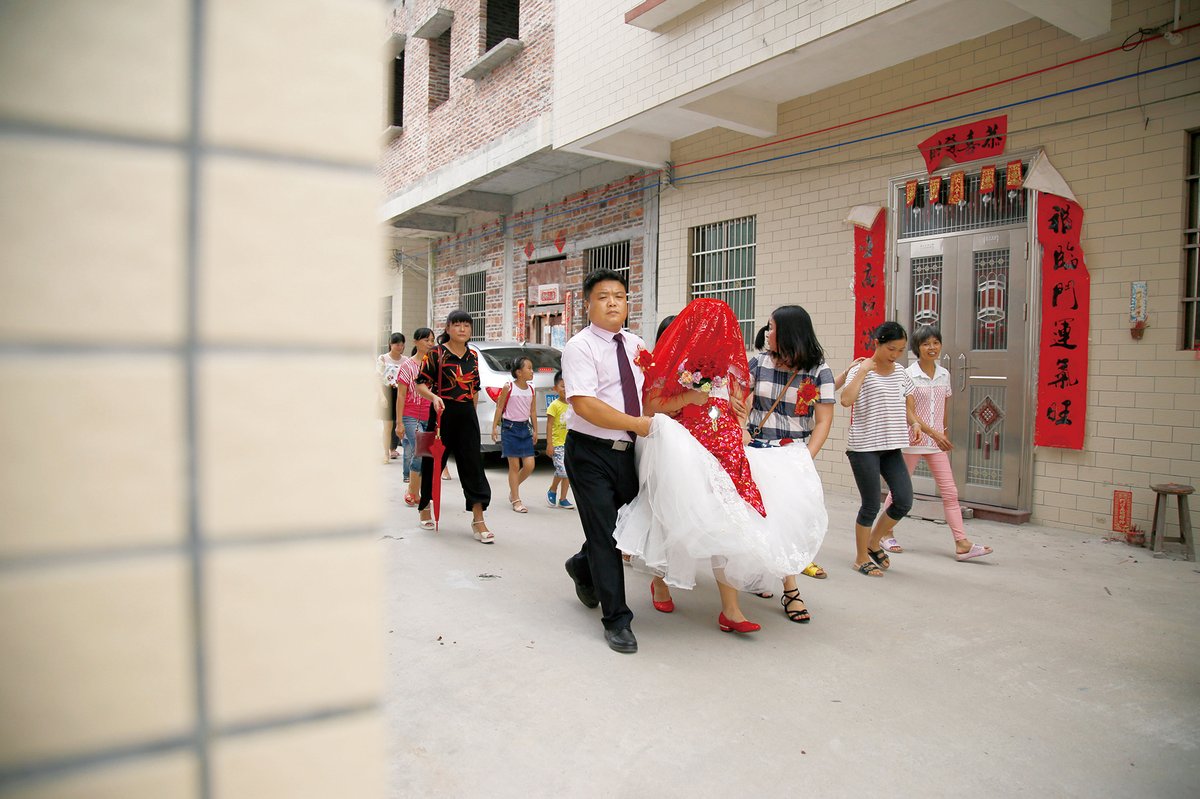 A village wedding ceremony: Despite Western-style dresses, many traditional elements remain