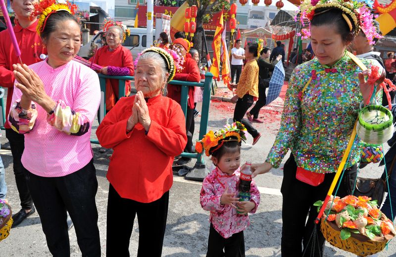 Chinese women of all ages wear floral hairpins in Xunpu, Fujian, China’s floral headdress tradition