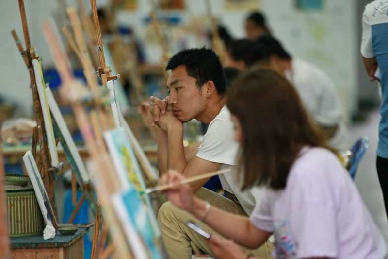 Artists from all around the country painting in Shuangxi as part of the charitable initiative Wang took part in