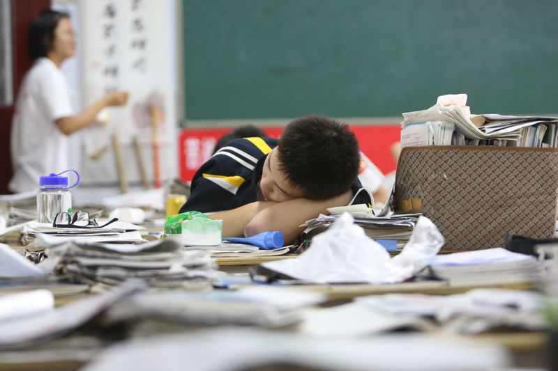 A student taking a break from studies at No. 2 High School , China’s exam-prep factory