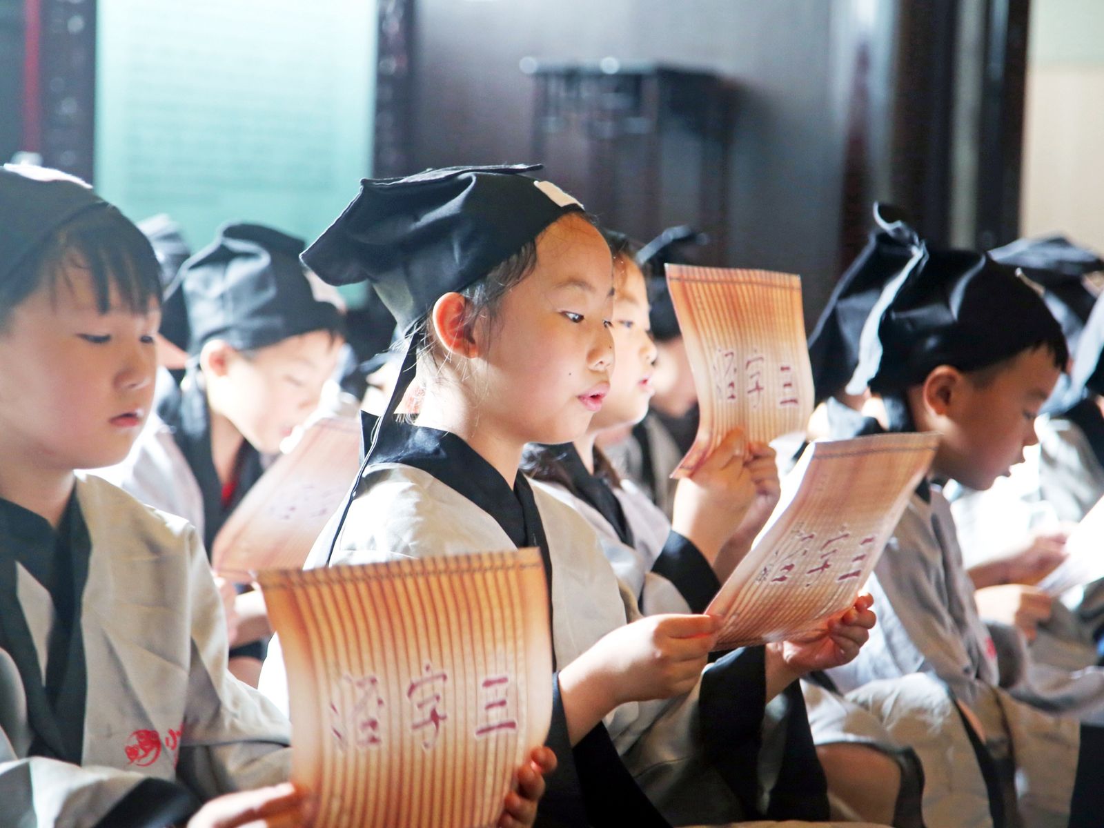 Young Chinese girls reading out loud