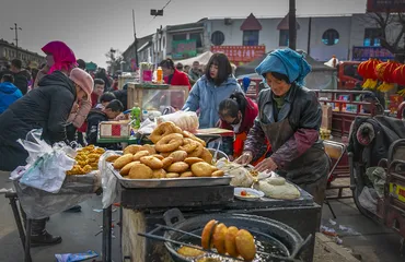 Villagers selling food in Pingliang, Gansu