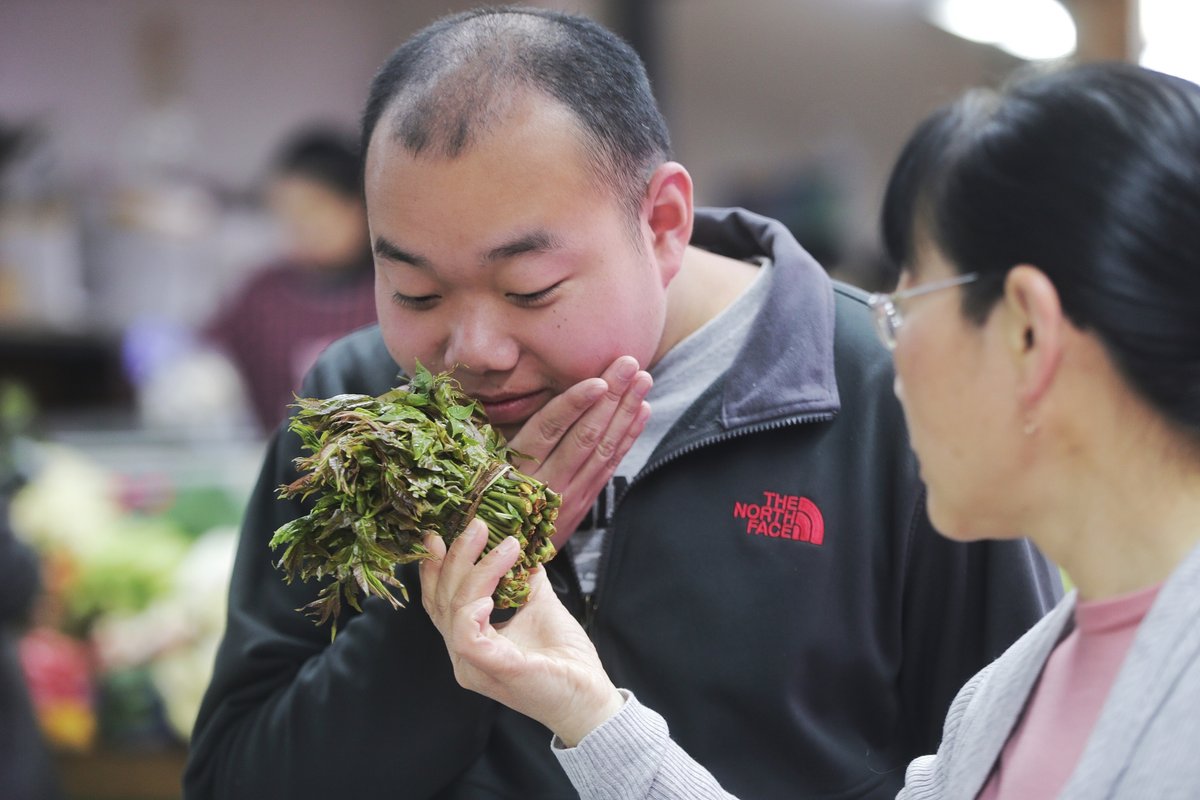 Zhao Xiaojiao, a professor at Xi’an University, takes her autistic son Wu Yongyi out every day to help him integrate with society