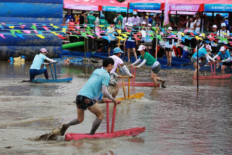 People gliding around on "Mud Horses" during an event, Ningbo Cuisine