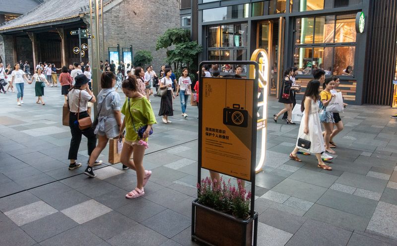 A sign in Chengdu Taikoo Li warning pedestrians to be aware of their image rights