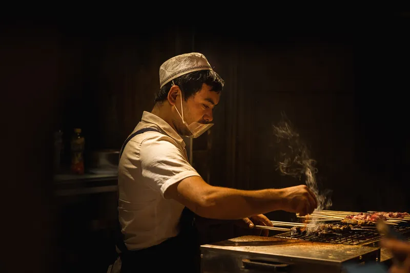 A man grilling in Xinjiang