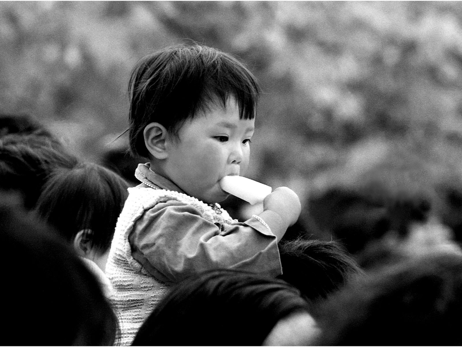 Chinese kid in Nanjing eating an ice cream (1983）