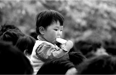 Chinese kid in Nanjing eating an ice cream (1983）
