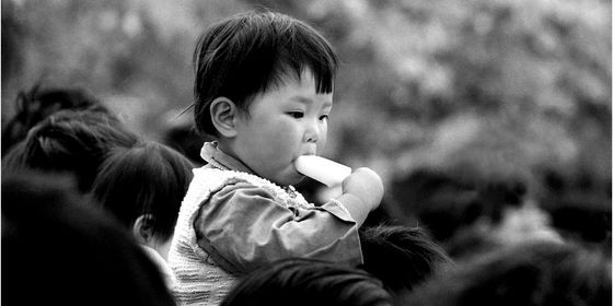 Chinese kid in Nanjing eating an ice cream (1983）