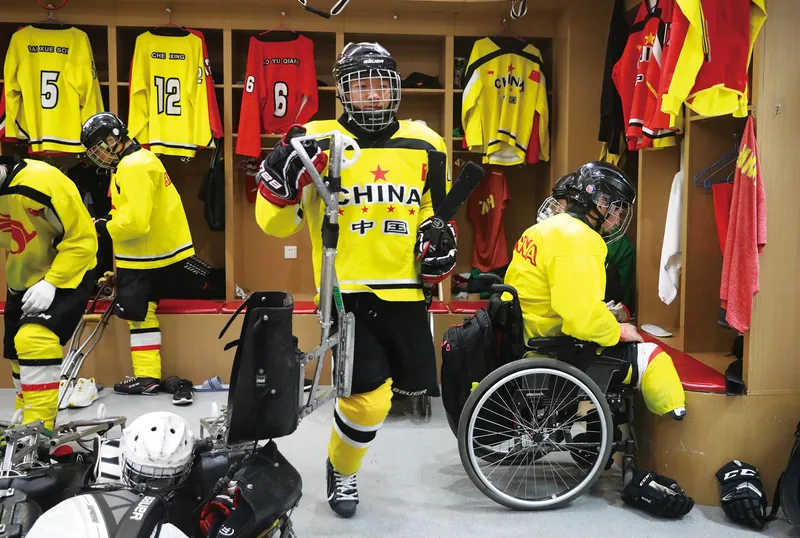 Ice hockey players get changed in the locker room before training
