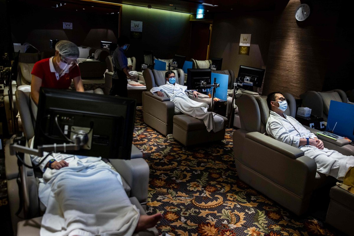 Customers relaxing and getting a massage at a bathhouse in Hong Kong