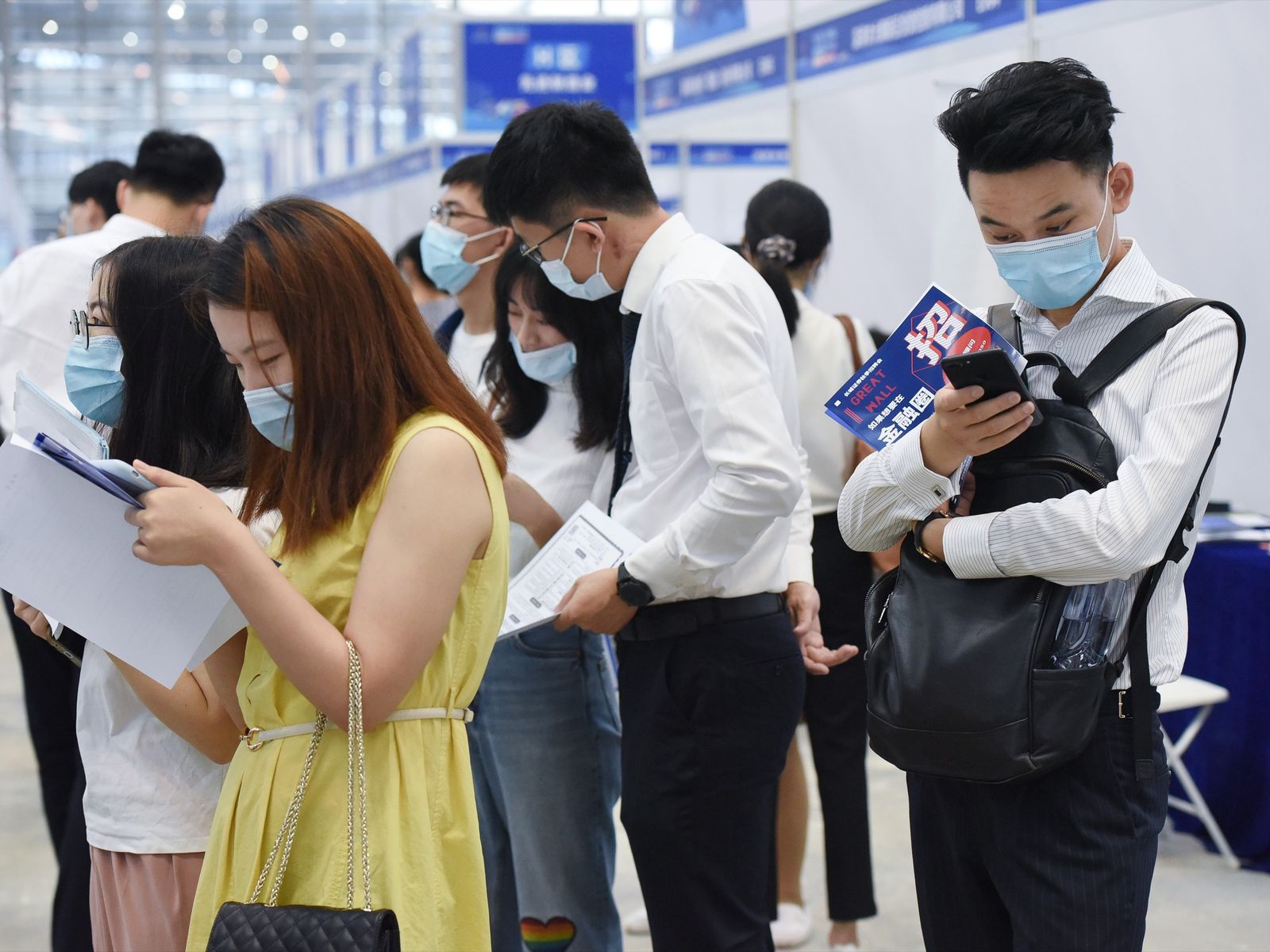 Young job seekers waiting in line