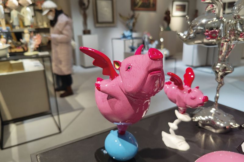 Colorful, trendy statues attract young customers in an art shop in Shanghai