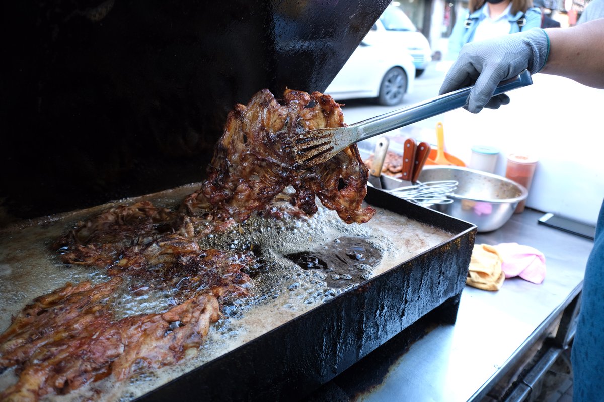 A street vendor cooking jijia in Shenyang, Liaoning province, Shenyang’s favorite dish