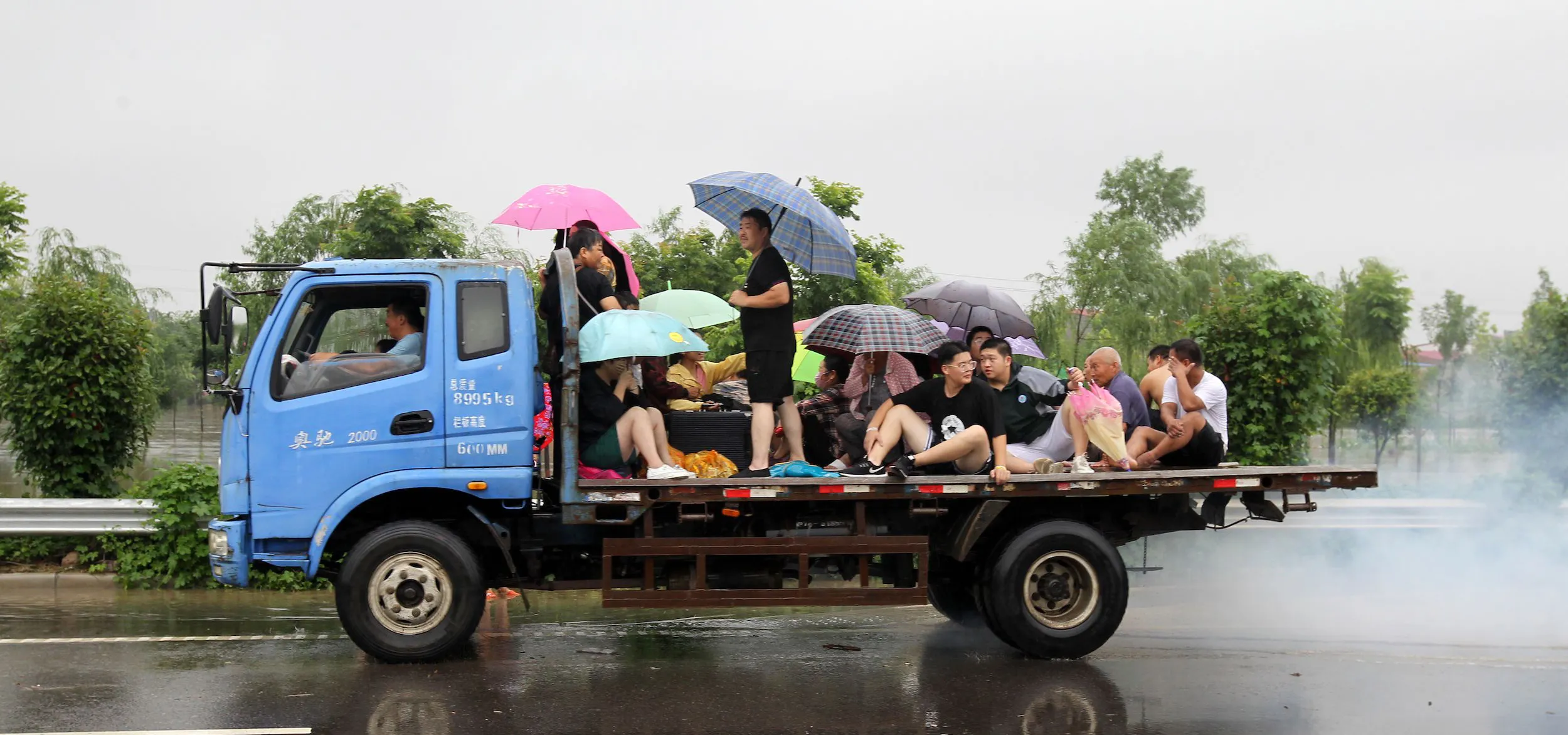 Zhengzhou residents on back of truck