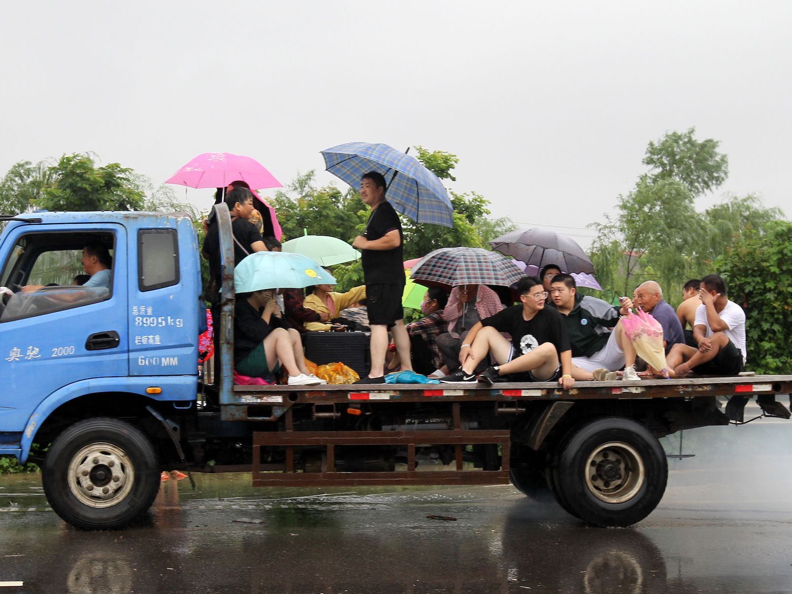Zhengzhou residents on back of truck