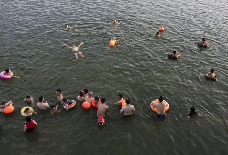 People swimming in water