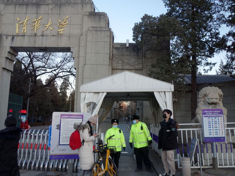 Tsinghua University security guards monitoring people leaving and entering campus