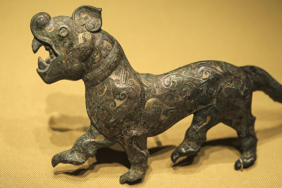 A tiger-patterned gold-and silver-inlaid belt hood for the noble in the Western Han dynasty (206 BCE – 25 CE) exhibited at the National Museum of China