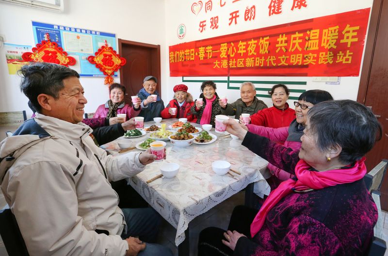 Old people celebrate New Year together in a community canteen