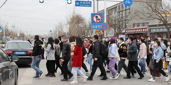 Commuters crossing the street