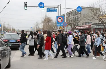 Commuters crossing the street