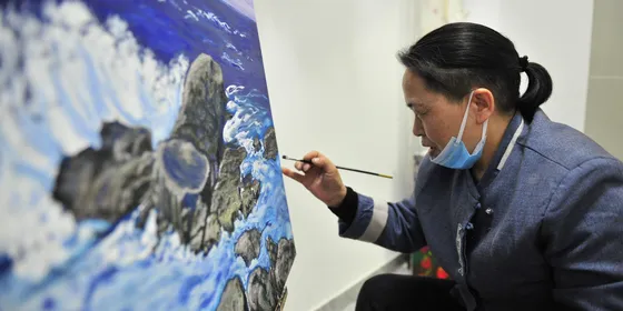 Artists in Beijing painting