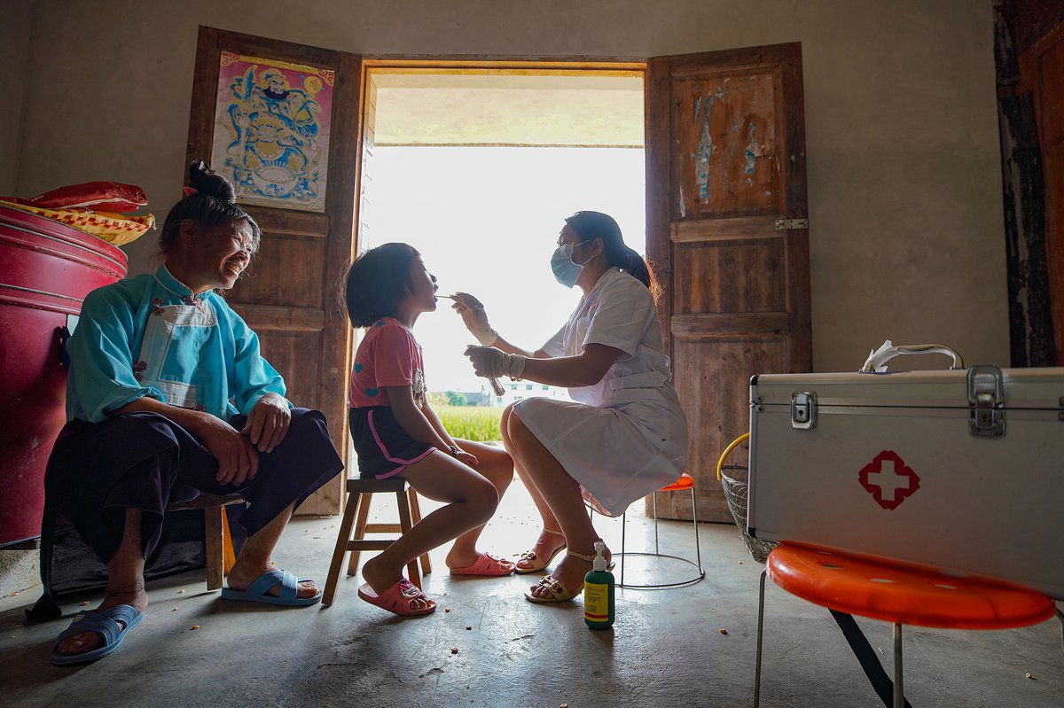 Wu Mingying, a village doctor in China making a house call