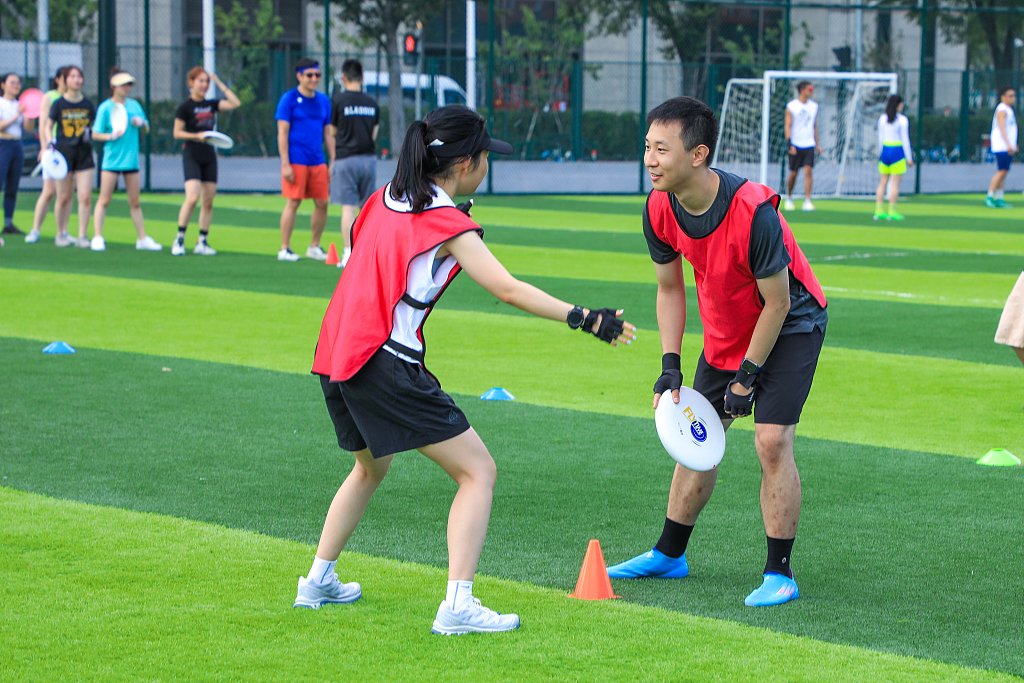 Young people playing Frisbee in Shanghai