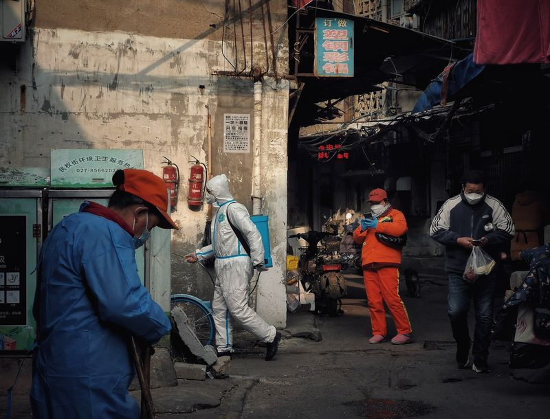 Epidemic prevention staff disinfecting the streets of Hualou Street in Hankou district, Wuhan