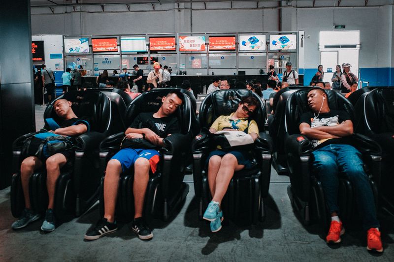 People sleeping on massage chairs in Zhuhai, Guangdong