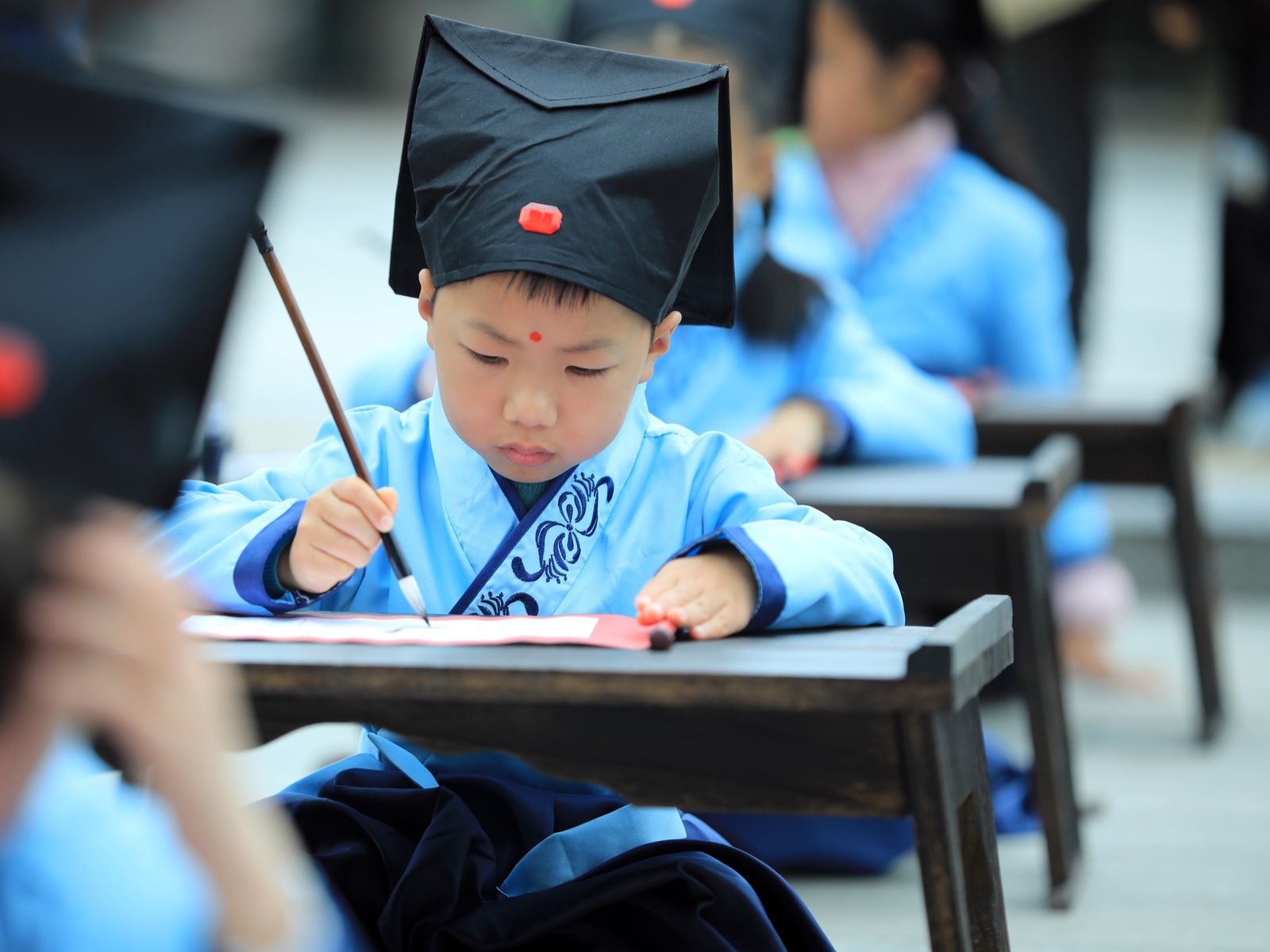 Young student in Shanghai learning penmanship
