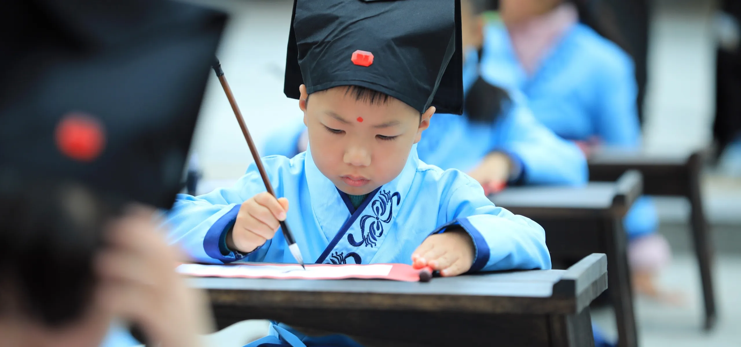 Young student in Shanghai learning penmanship