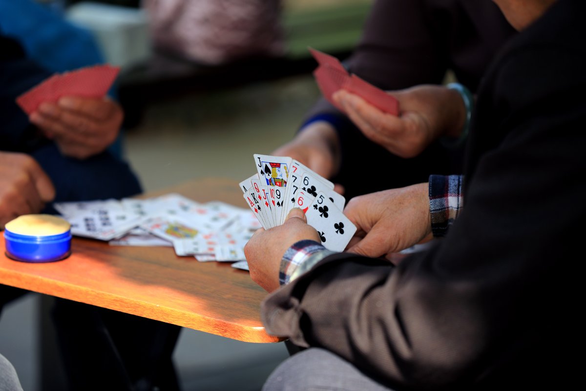 Elderly residents playing a game of Guandan in Jiangsu province, china card game