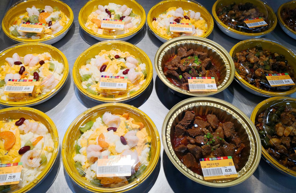 Pre-prepared meals sitting on display at a market in Hangzhou