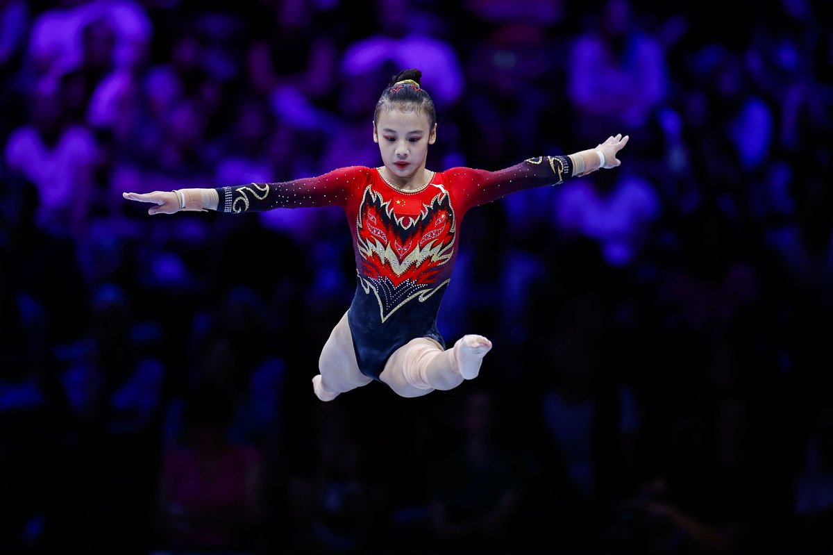 Chinese olympian Qiu Qiyuan performing atop the balance beam in Belgium, 2024 Paris Olympics