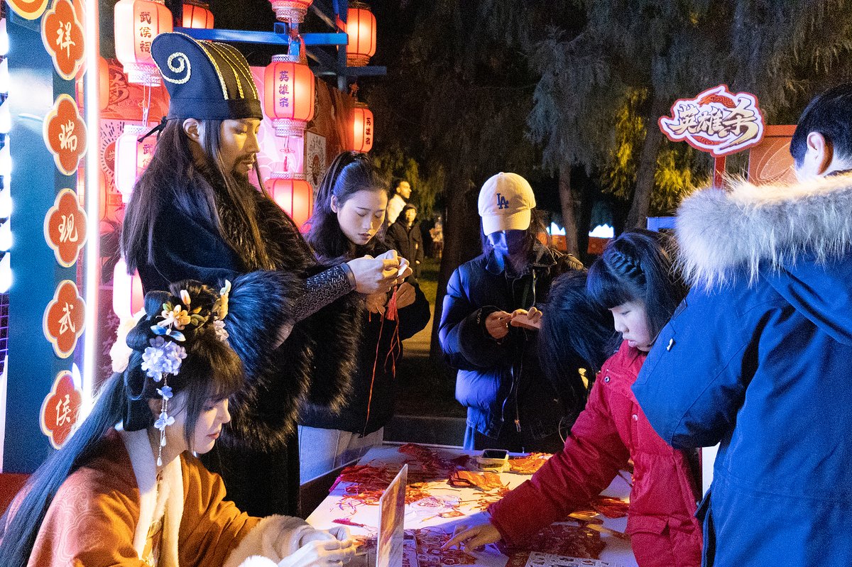 A staff member at Wuhou Shrine in Chengdu, Sichuan, dressed as Zhuge Liang to interact with visitors during the Lantern Festival in 2024
