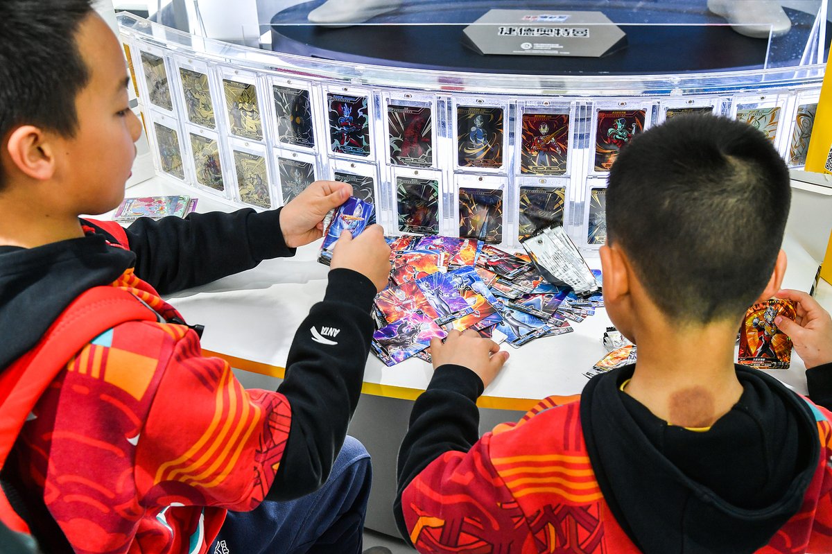 Collectible cards featuring characters like My Little Pony and Ultraman are booming online and offline, but their popularity among minors has sparked concerns over addiction and exploitation.