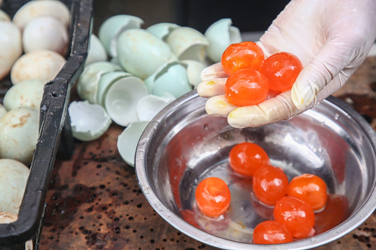 Well-made salted egg yolks turn bright orange or even red, and ooze oil